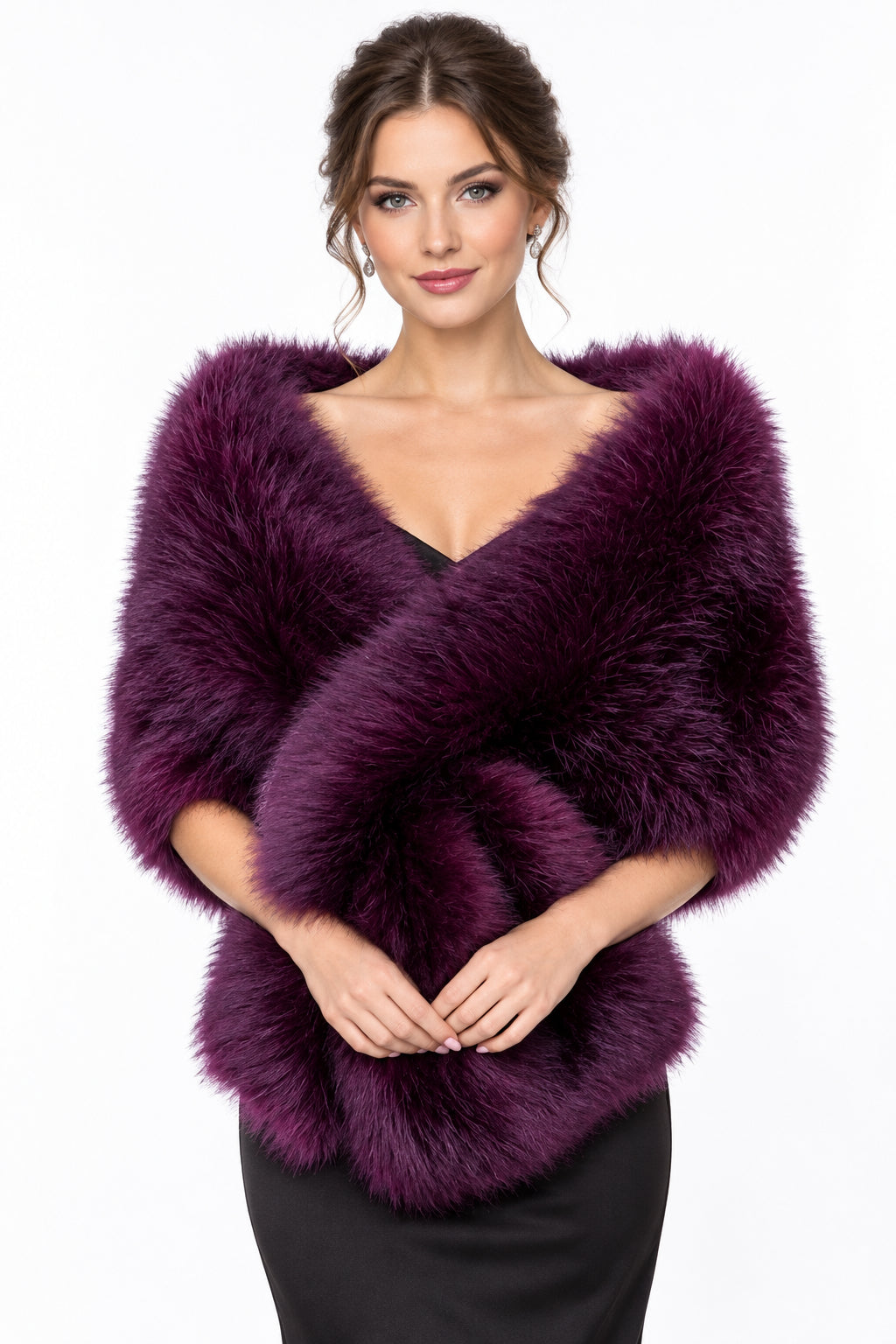 A deep burgundy faux fur wrap or shawl draped over a white dress form, set against a blurred green garden background.